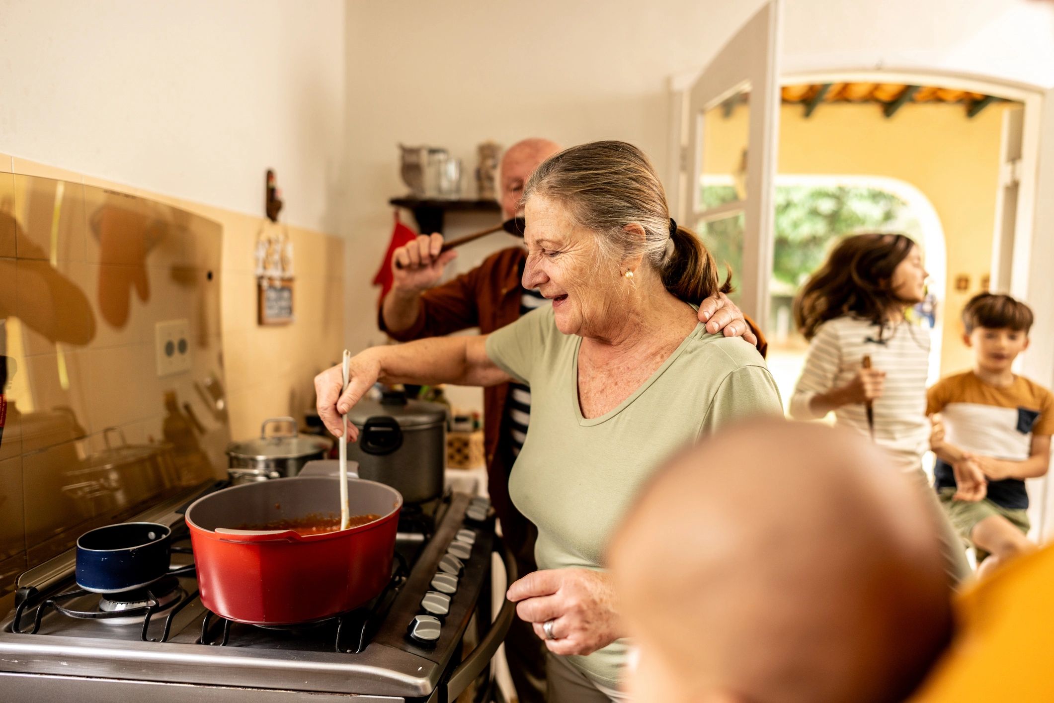 Family cooking together in a home kitchen